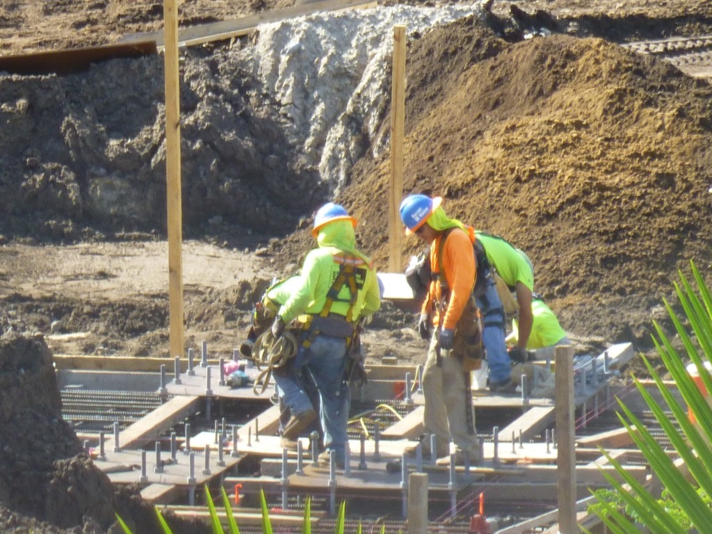 Interwoven steel supports being installed below ground before pouring foundation