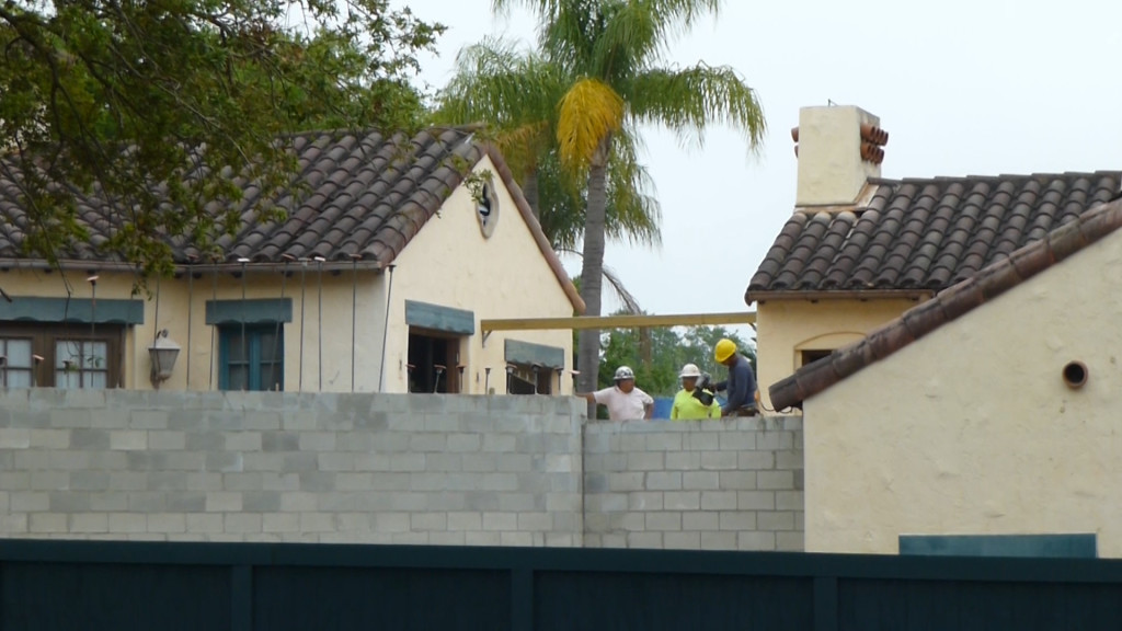 Workers working on the new wall