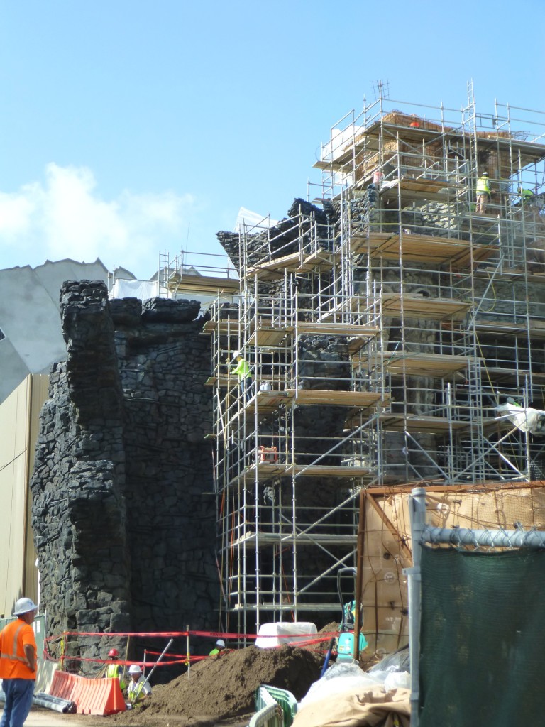 The bricks get bigger as they get closer to the ground to create a sense of forced perspective scale