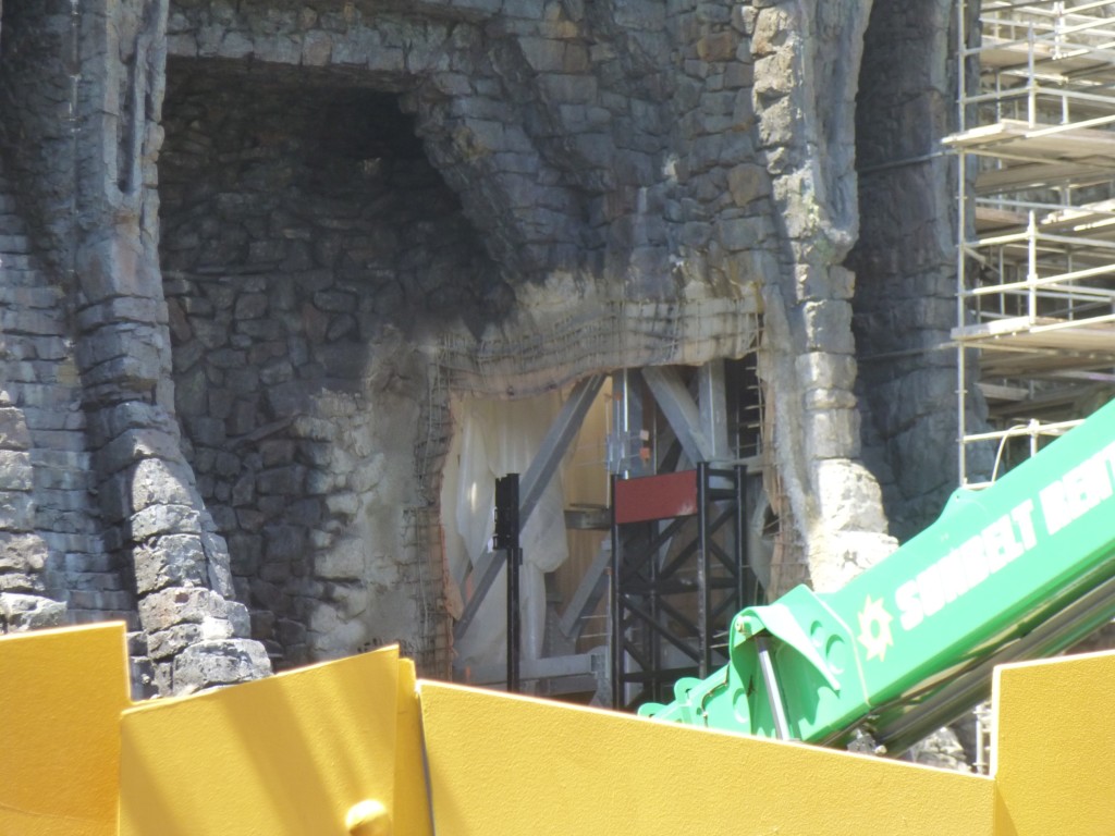 Looks like gate hinges are being installed to hold the giant doors that swing open as your car approaches