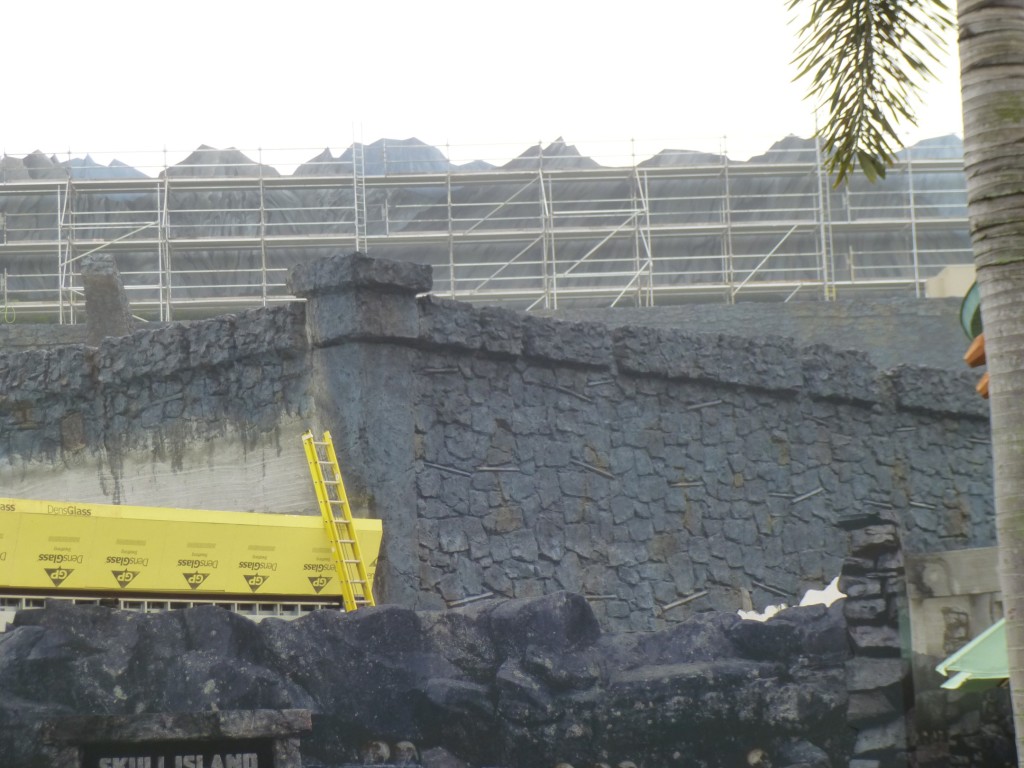 Indoor queue building with mountain range seen rising above