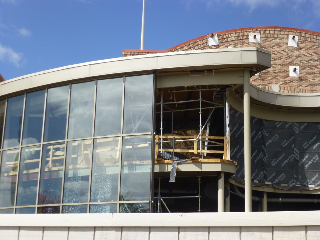 Front entrance walls may come out this far to sides? Why else would they remove these windows?