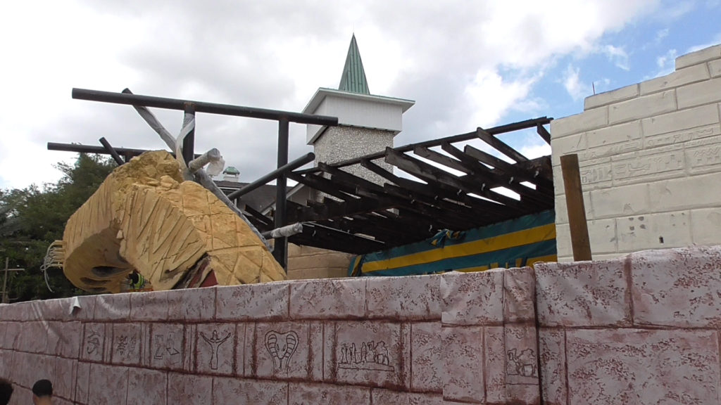 Awning for air conditioned queue entrance here