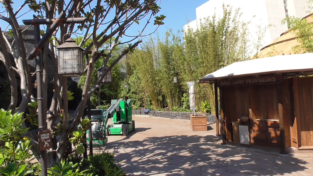 Ride exit path, with stroller parking sign and gift shop cart