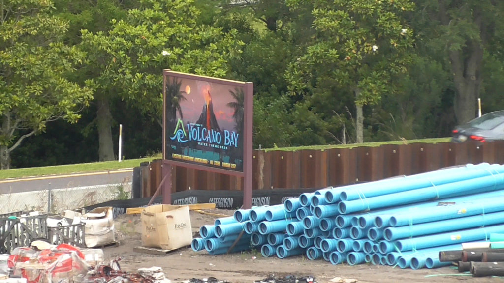 Lots of pipes lying around the perimeter of the work site to be installed