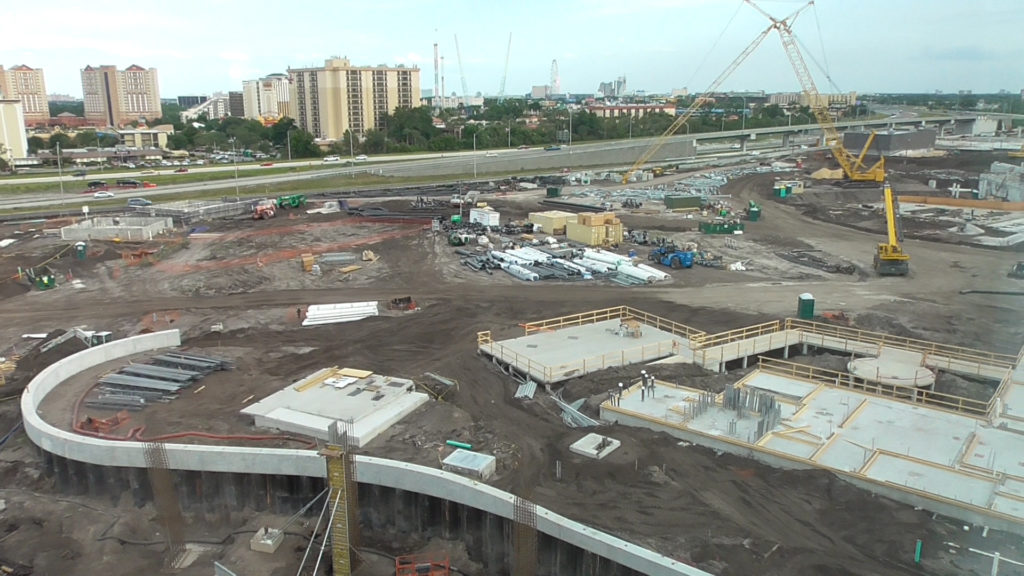Side of the construction zone, with I-4 in the background and berm separating the park from Cabana Bay at the bottom of the image