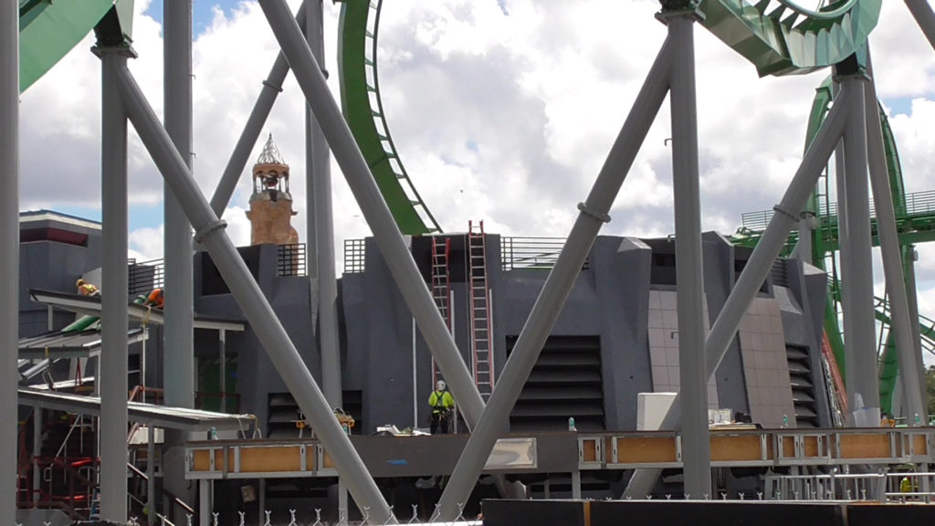 Decoration being added to queue building and covered staircase receiving work on left