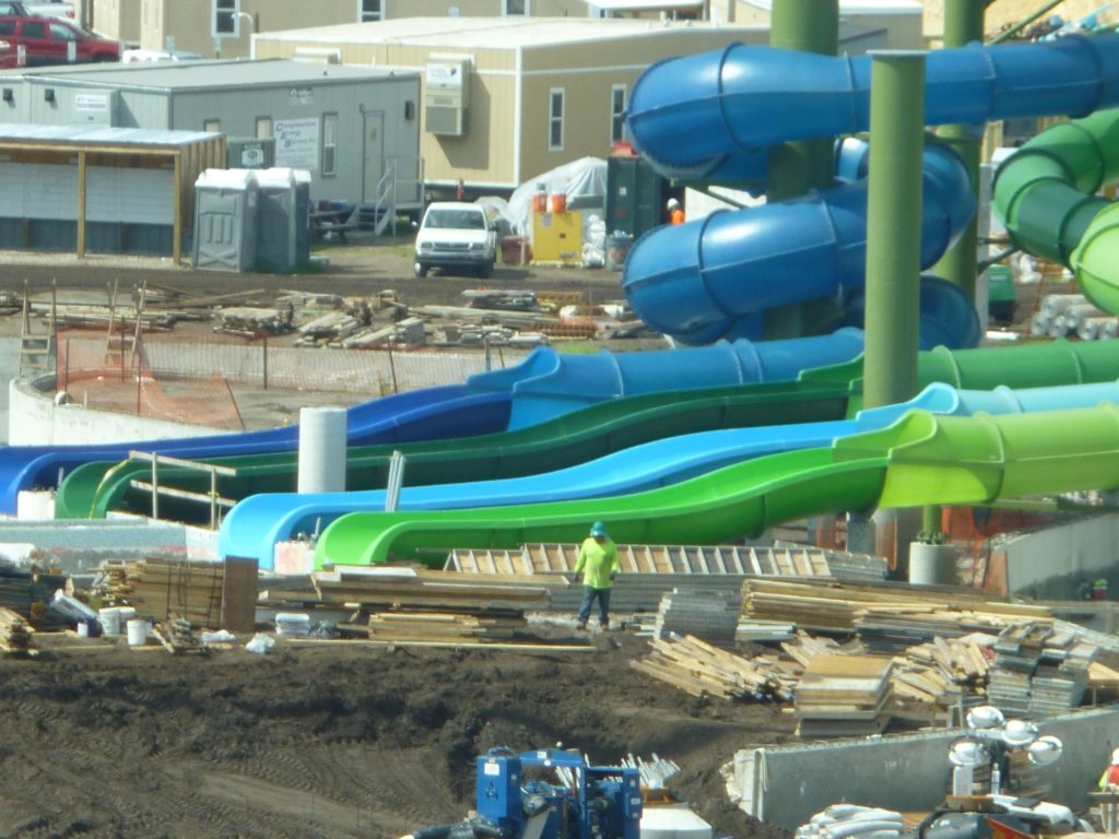 The slide exit pools are already starting to get tiled!