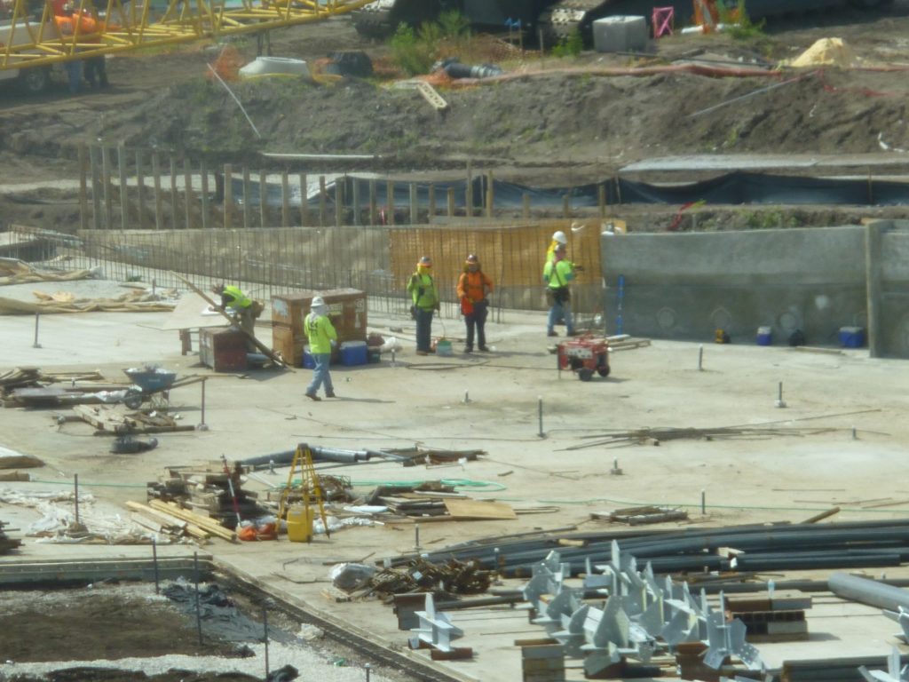 Workers inside wave pool area