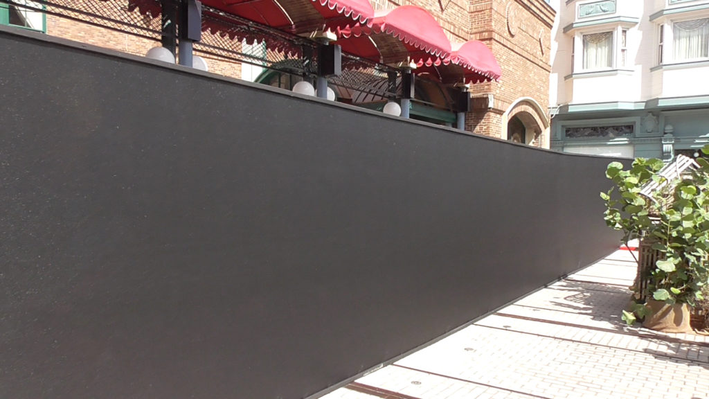 A big blank wall is in front of the graffiti work walls