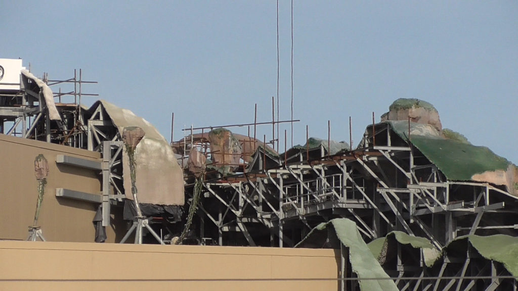 Baby floating mountains behind the facade