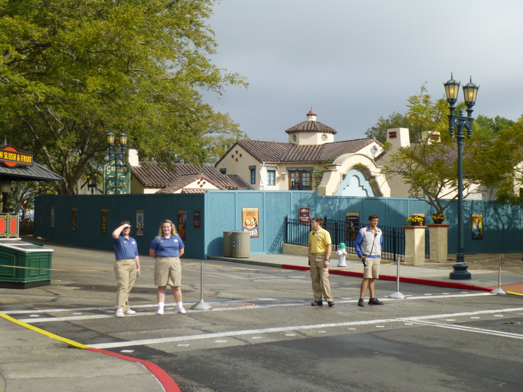 Cast members redirecting traffic down toward the lagoon as walkway was closed off