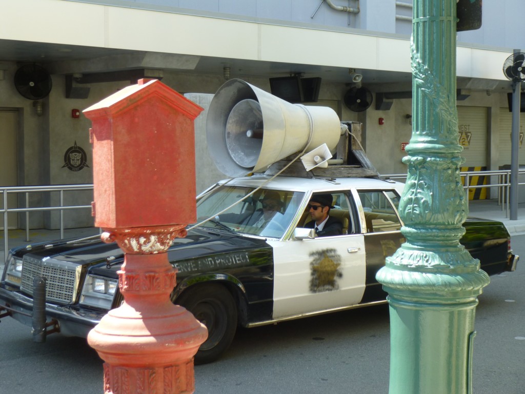 The brothers driving up in their iconic used police car