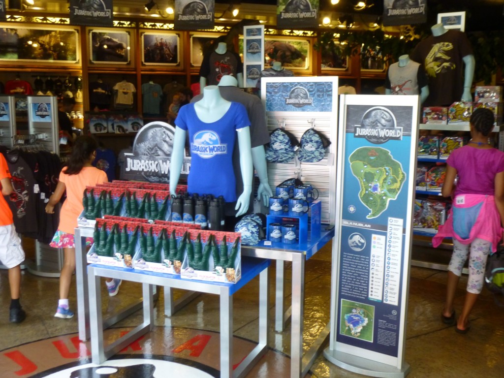 Jurassic World merchandise surrounded by new logo signage