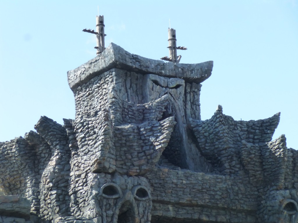 Sacrificial posts atop the temple entrance
