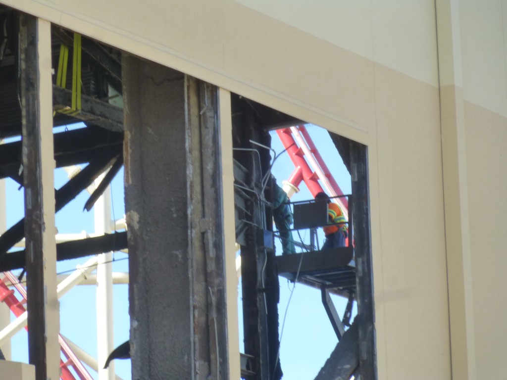 Workers stripping the building