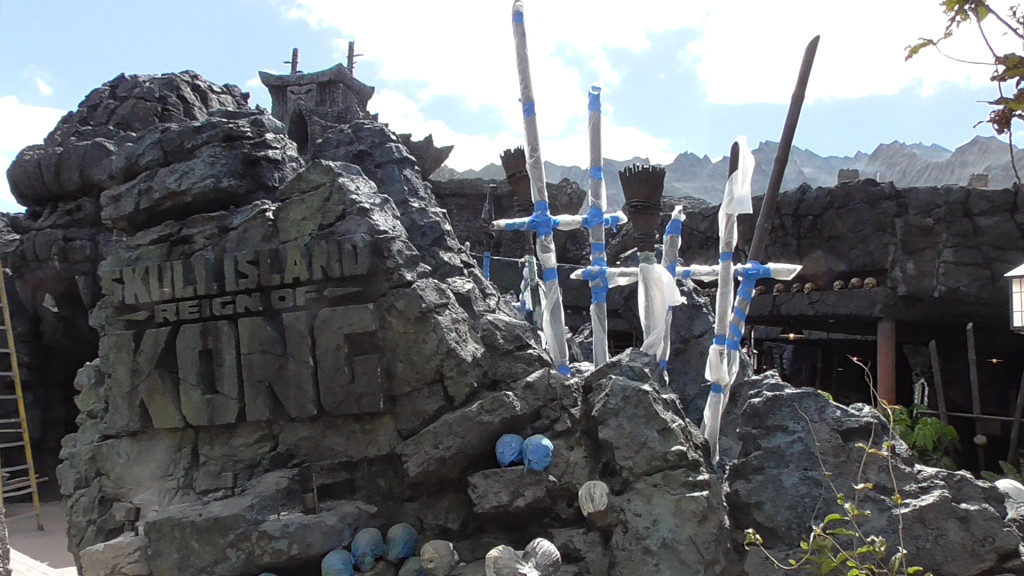 New sign embedded in rockwork at entrance, along with torches, skulls and spears