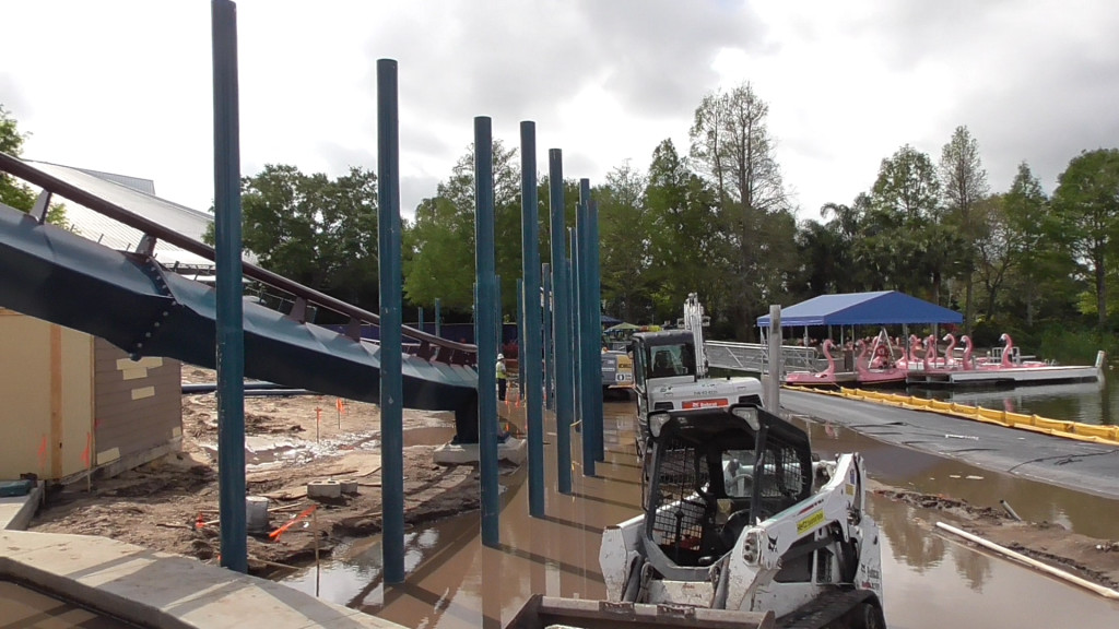 Wall being built around track over lagoon