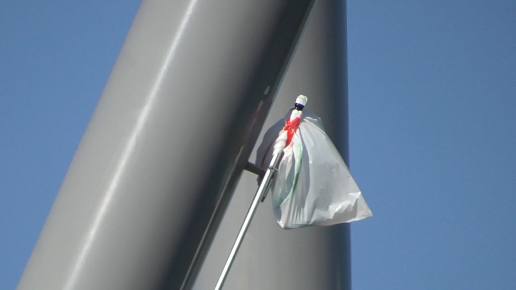 Cables running through conduit wrapped in bags