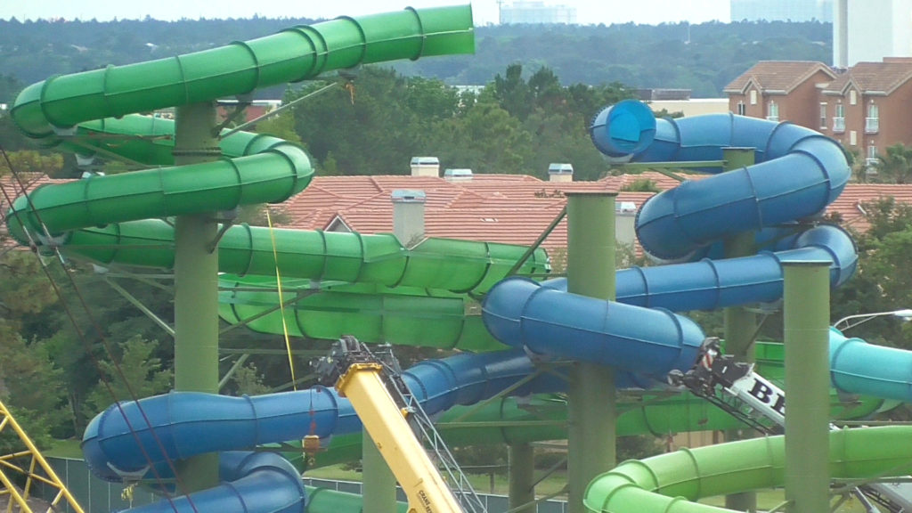 Intertwining slides still being built up towards the sky