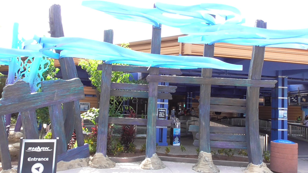 Theming in front of shark feeding tank and restaurant entrance