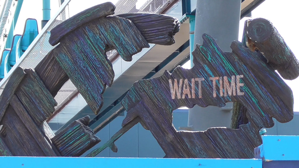 Wait time sign beautifully weathered to look underwater rotted