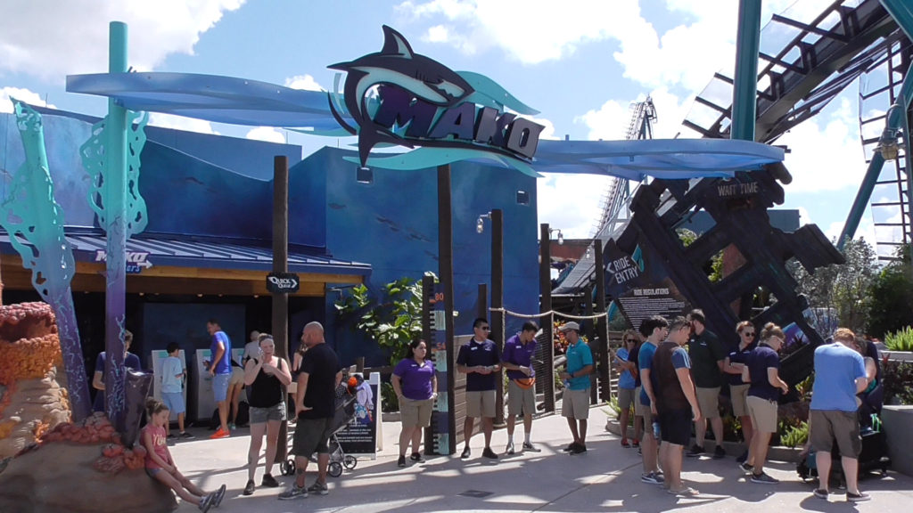 The Mako ride entrance, surrounded by staff handing out Soft Open tickets