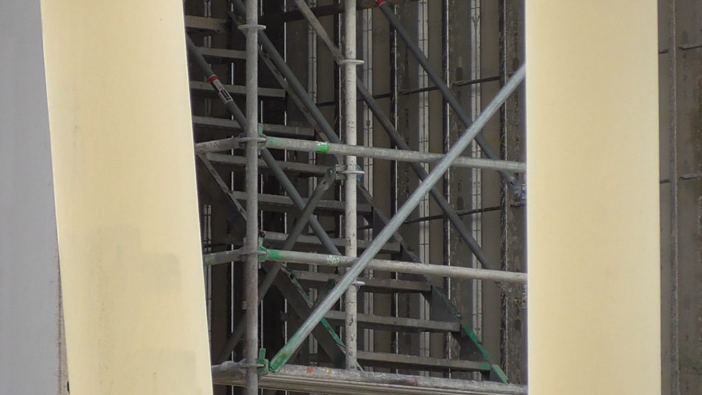 Several levels of stairs in back corner for workers