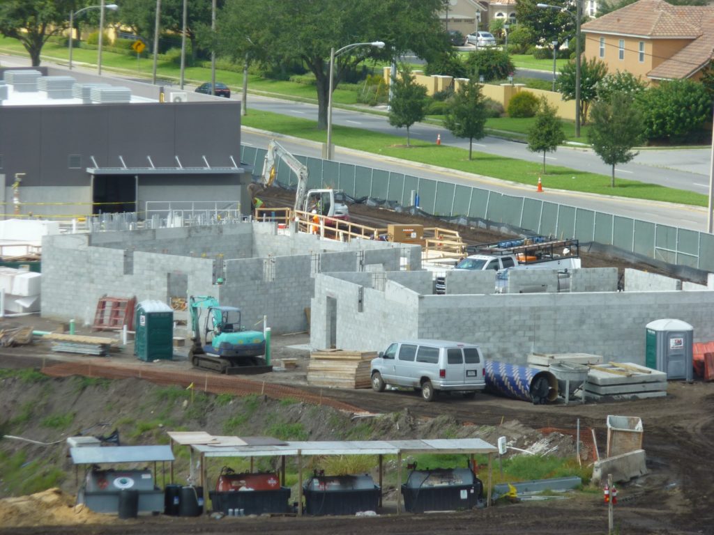 Two smaller buildings being added near the larger building