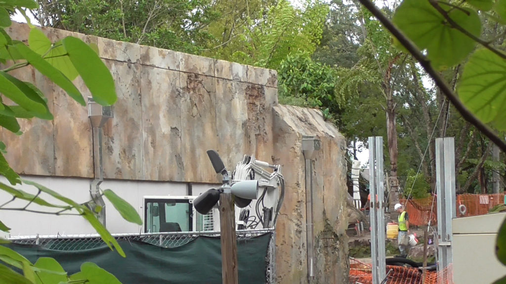 View of the side of a building and work going on on the ground