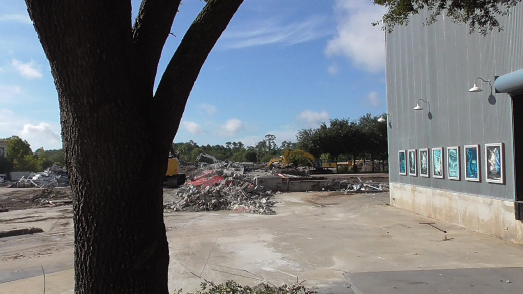 Piles of debris sit where Backlot Tour Entrance once stood