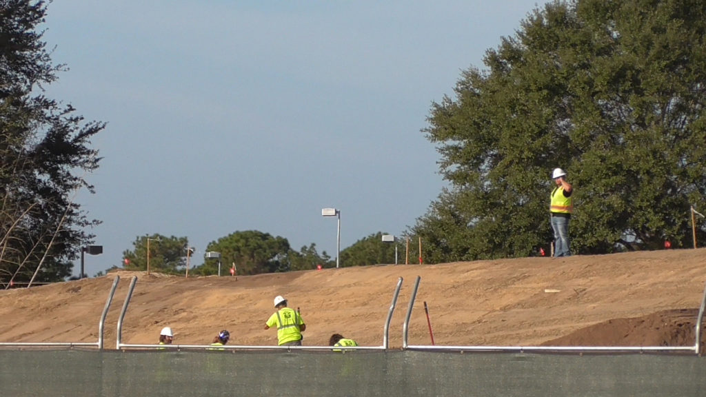 Workers on new berm